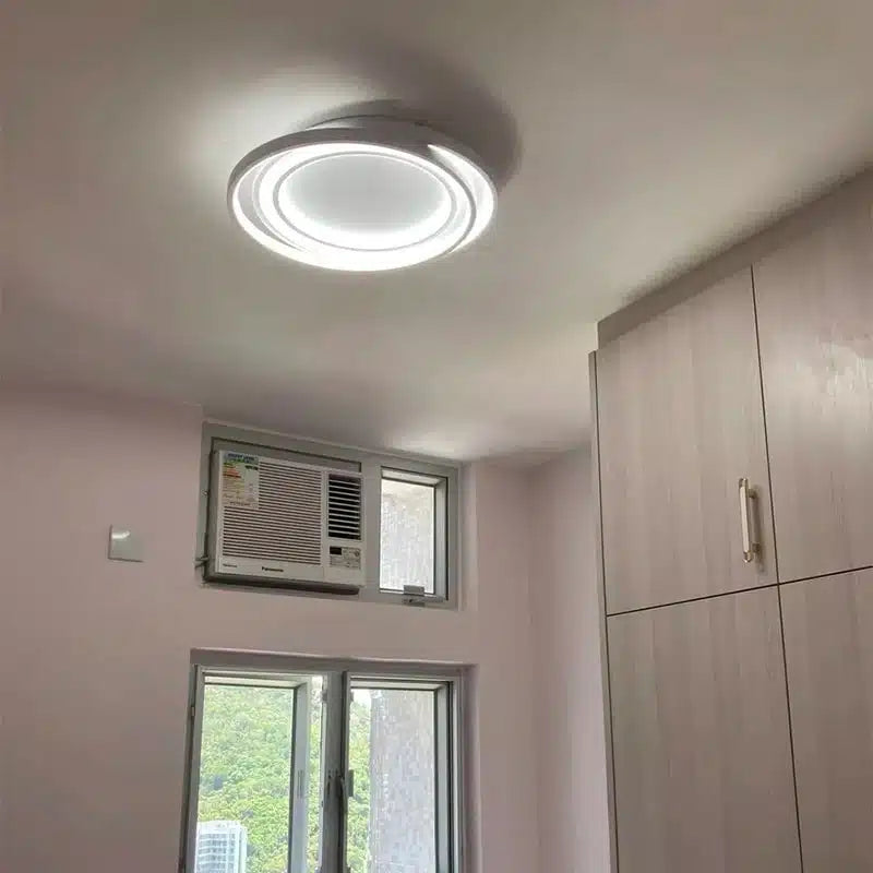 Plafonnier LED ultra fin au design moderne avec formes rondes entrelacées