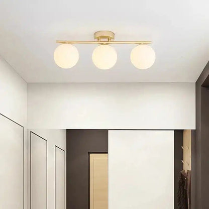 Plafonnier LED en verre nordique en duo ou trio boules blanches pour Salon - Luminenza - Doré